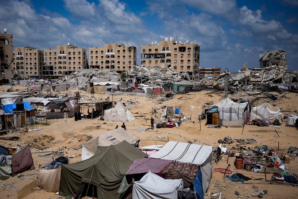 Palestinians displaced by the Israeli air and ground offensive on the Gaza Strip flee from Hamad City, the Gaza Strip, occupied Palestine, following an evacuation order, Sunday, August 11, 2024 (AP)