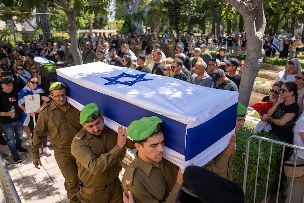 Israeli soldiers carry the casket of reservist Master Sgt. Valeri Chefonov during his funeral at the military cemetery in Netanya, occupied Palestine, on Friday, July 12, 2024 (AP) 