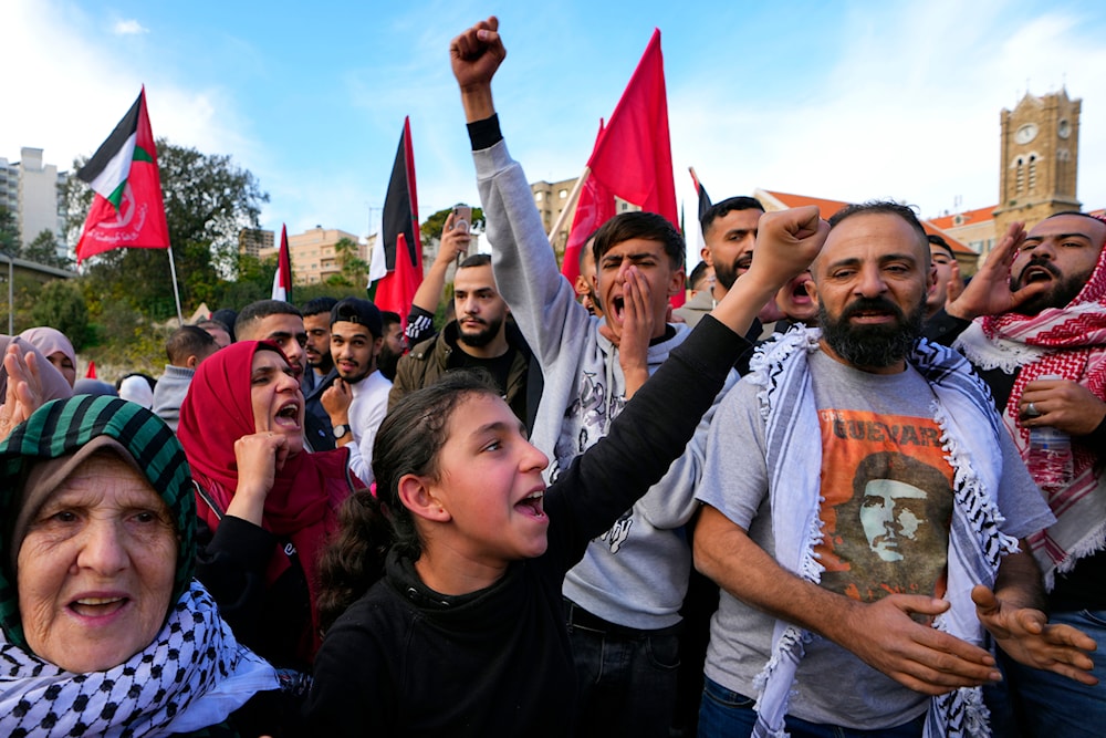 Supporters of the leftist Palestinian group, the Popular Front for the Liberation of Palestine (PFLP), chant slogans during a protest in solidarity with the Palestinian people in Gaza Strip in Beirut, Lebanon, Sunday, December 17, 2023 (AP)