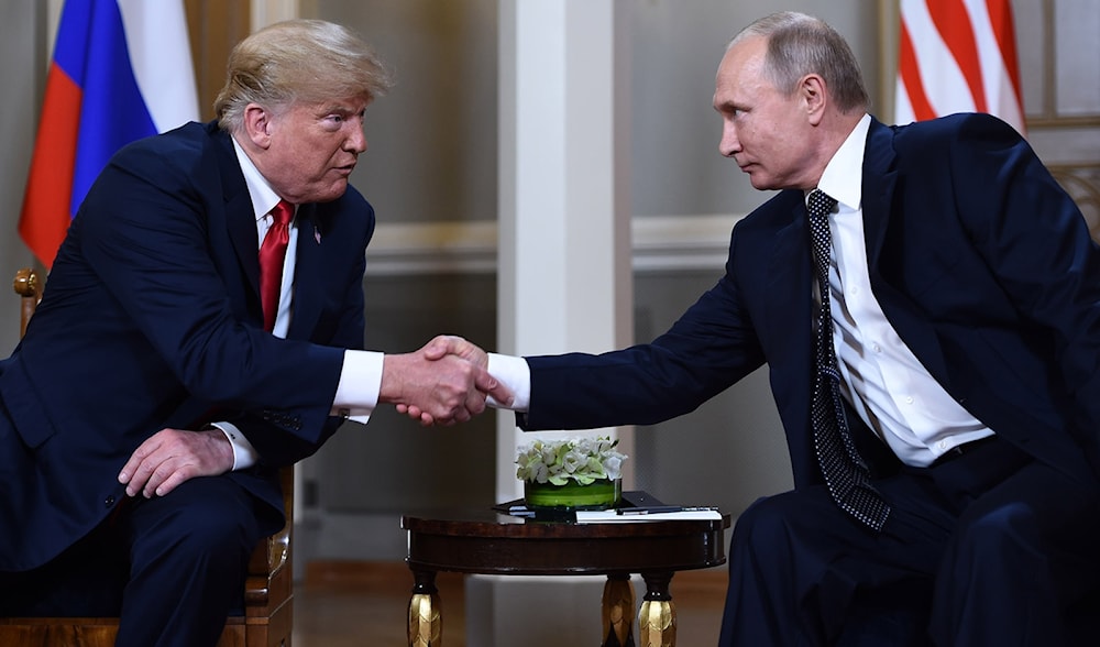 Trump shakes hands with Putin before their closed-door meeting, July 16, 2018. (AFP)