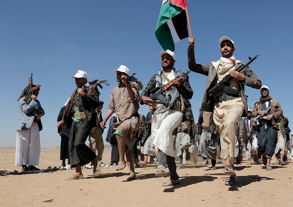 Ansar Allah fighters march during a rally of support for the Palestinians in the Gaza Strip and against the US strikes on Yemen outside Sanaa on January 22, 2024