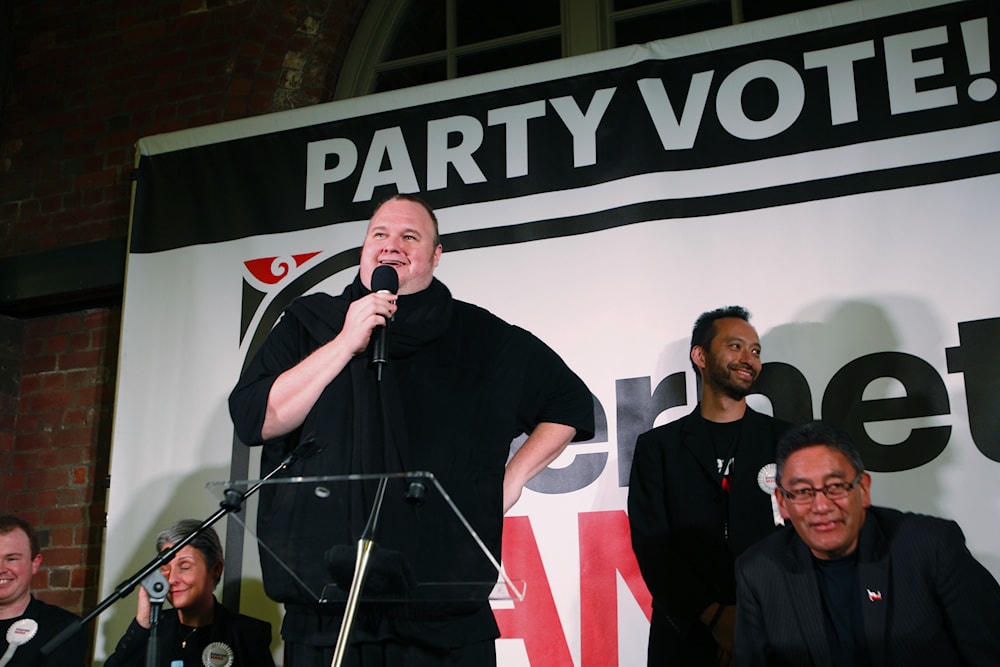 In this Monday, Aug. 4, 2014 photo, indicted Internet entrepreneur Kim Dotcom, center, speaks at a political rally, in Wellington, New Zealand. (AP)