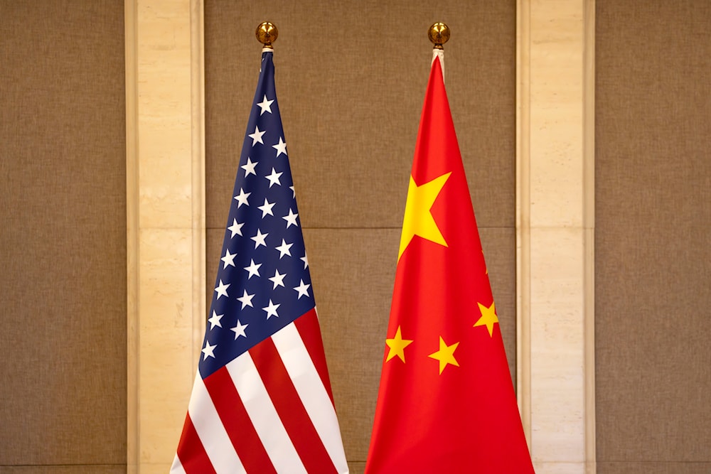 U.S. and Chinese flags are set up at the Diaoyutai State Guesthouse in Beijing, on July 8, 2023. (AP/Pool)