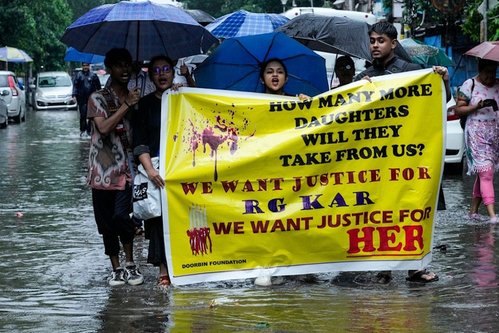 Members of West Bengal Junior Doctors' Front and nursing students shout slogans  during a protest against the rape and killing of a trainee doctor at a government hospital in Kolkata last week, in Kolkata, India, Sunday, Aug. 18, 2024. (AP)