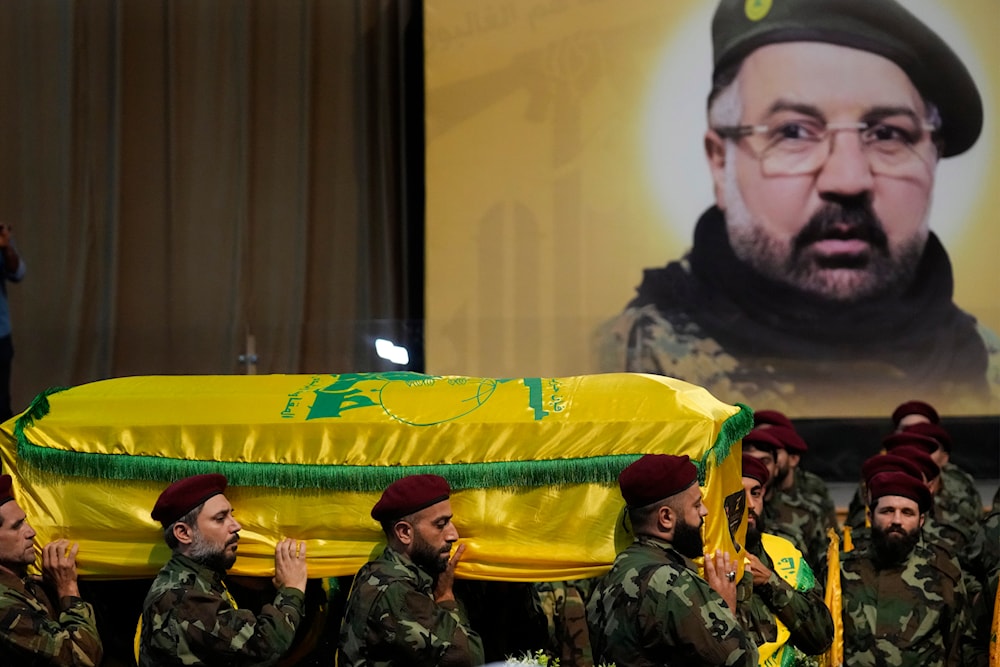 Hezbollah fighters carry the coffin of their top commander Fouad Shokor, who was killed by an Israeli airstrike on Tuesday, July 30, during his funeral procession in a southern suburb of Beirut, Lebanon, August 1, 2024 (AP)