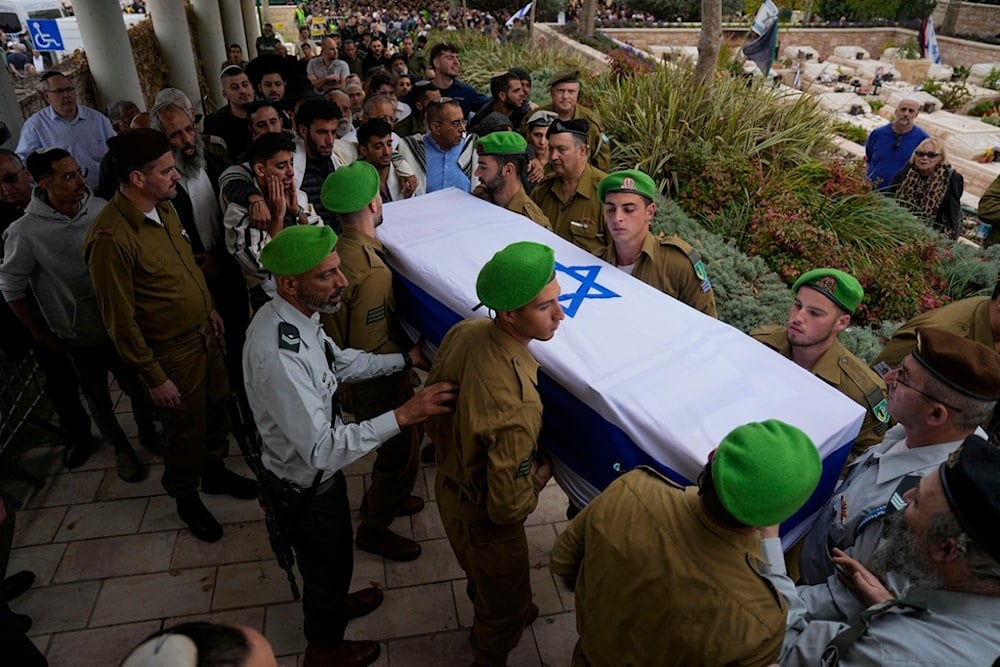 Israeli occupation soldiers carry the flagged covered coffin of an occupation Sergeant killed during confrontations with Palestinian Resistance in the Gaza Strip, 'Israel', Dec. 21, 2023. (AP)