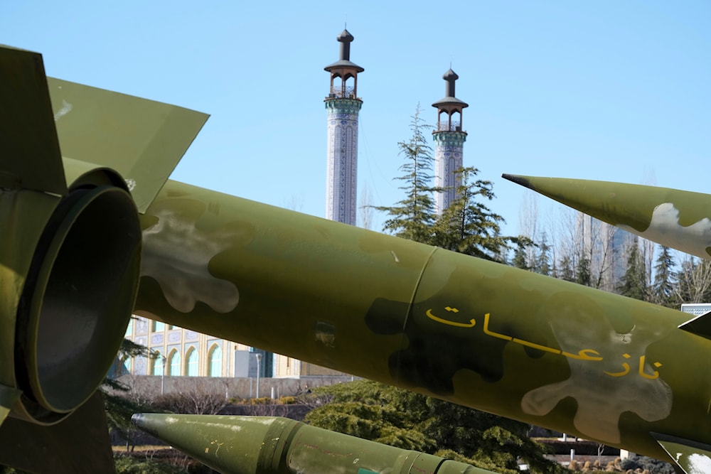 Missiles are displayed in a permanent exhibition at a recreational area as minarets of a mosque are seen at rear, in northern Tehran, Iran, on February 3, 2023. (AP)