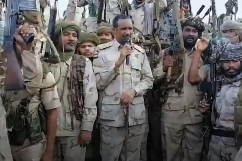 Commander Mohamed Hamdan Dagalo addresses Rapid Support Forces (RSF) fighters at an undisclosed location in July 2023 [Handout of video screen grab from Rapid Support Forces]