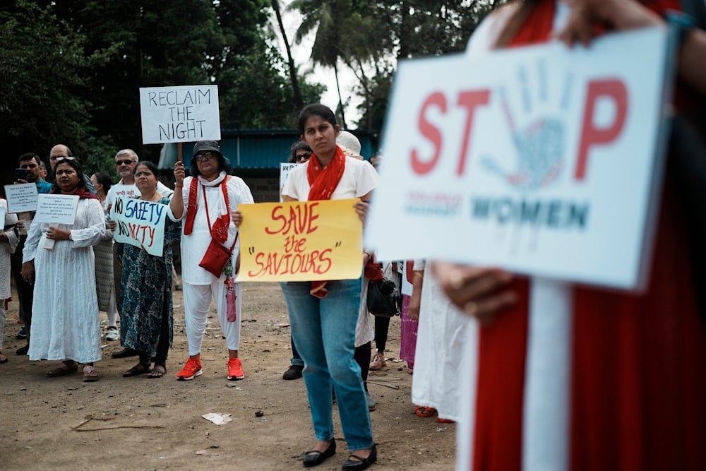 Indians protesting against the rape and killing of a trainee doctor at a government hospital in Kolkata, hold placards in Mumbai, India, Monday, August 19, 2024 (AP)