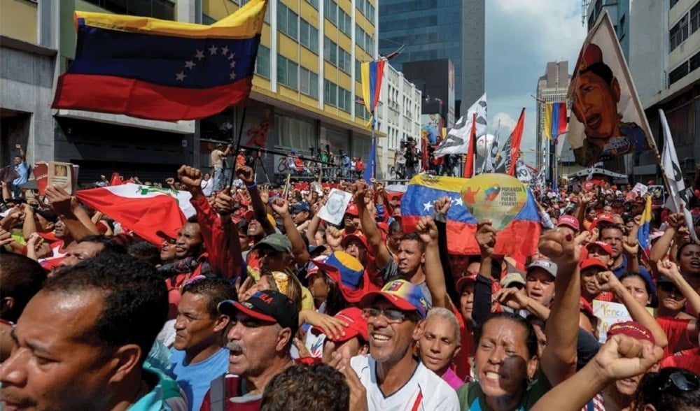 Supporters of Venezuelan Nicolas Maduro take part in a rally against the secretary general of the Organization of American States (OAS) in Luis Almagro in Carcas on March 28, 2017. (AFP)