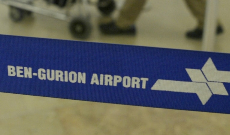 A man pushes his luggage in Ben Gurion airport near Tel Aviv, 'Israel', Tuesday Sept. 21, 2004. (AP)