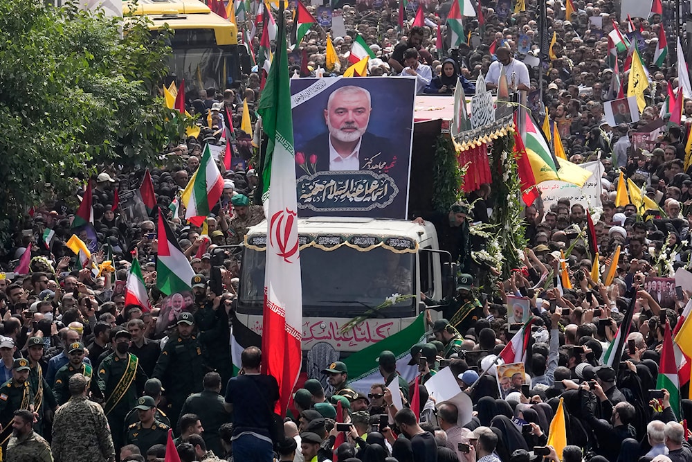 A truck carries the coffins of Hamas leader Ismail Haniyeh and his bodyguard during their funeral ceremony at Enqelab-e-Eslami Sq. in Tehran, Iran, Aug. 1, 2024. (AP)