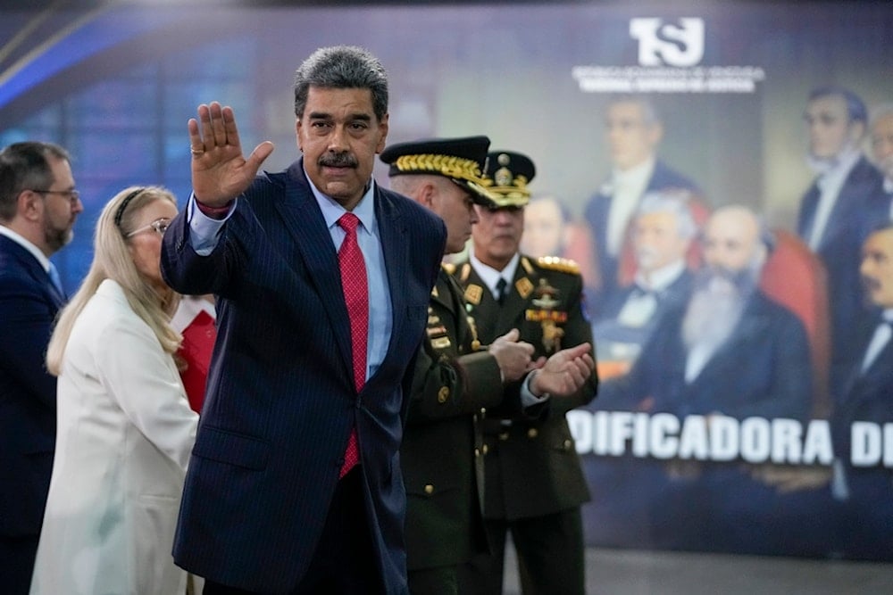 Venezuelan President Nicolas Maduro waves after speaking to the press at the Supreme Court in Caracas, Venezuela, Wednesday, July 31, 2024. (AP)