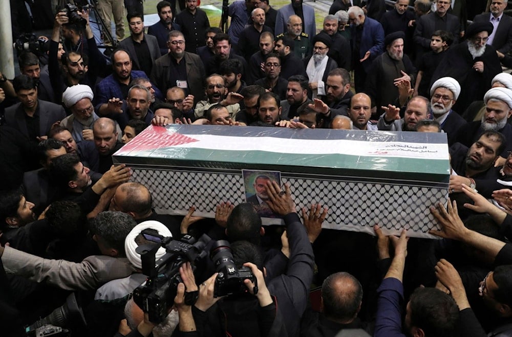 People carry the coffin of Hamas leader Ismail Haniyeh who was assassinated by 'Israel' on Wednesday, during his funeral ceremony at the Tehran University campus, in Tehran, Iran, Aug. 1, 2024. (AP)