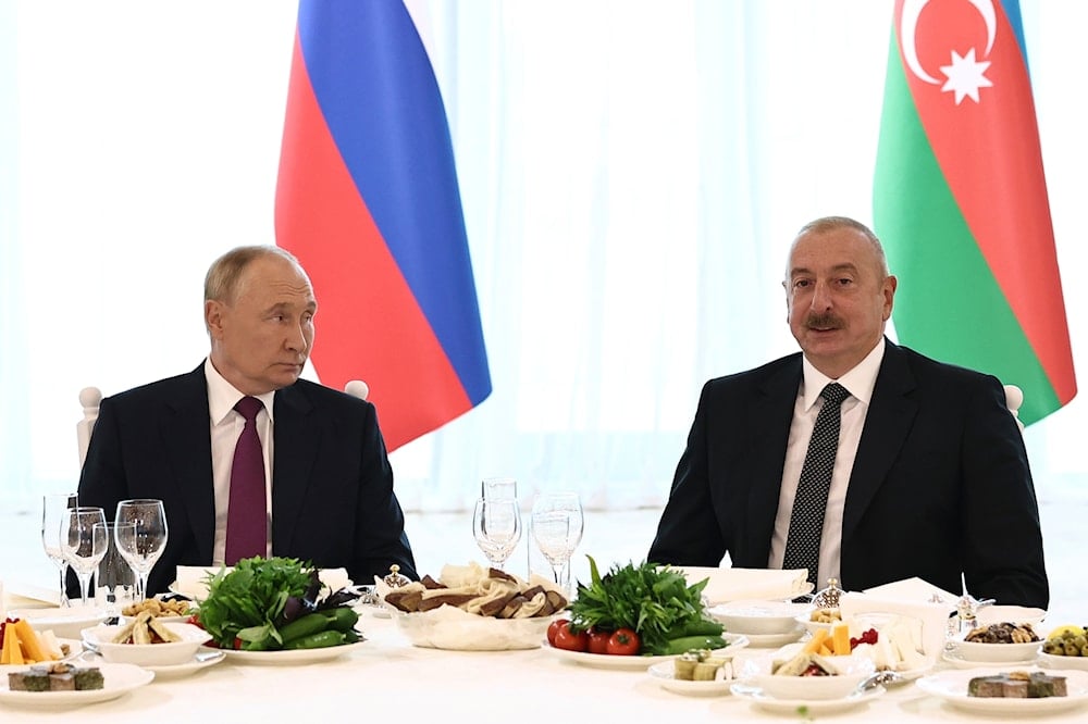 Russian President Vladimir Putin, left, and Azerbaijani President Ilham Aliyev attend a state reception at the Gulustan Palace in Baku, Azerbaijan, on August 19, 2024. (AP)