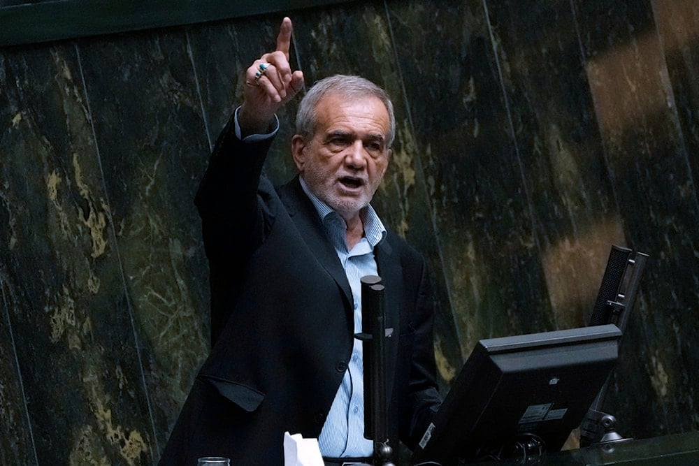 Iranian President Masoud Pezeshkian speaks in an open session of parliament to debate on his proposed ministers, in Tehran, Iran, Saturday, Aug. 17, 2024. (AP)