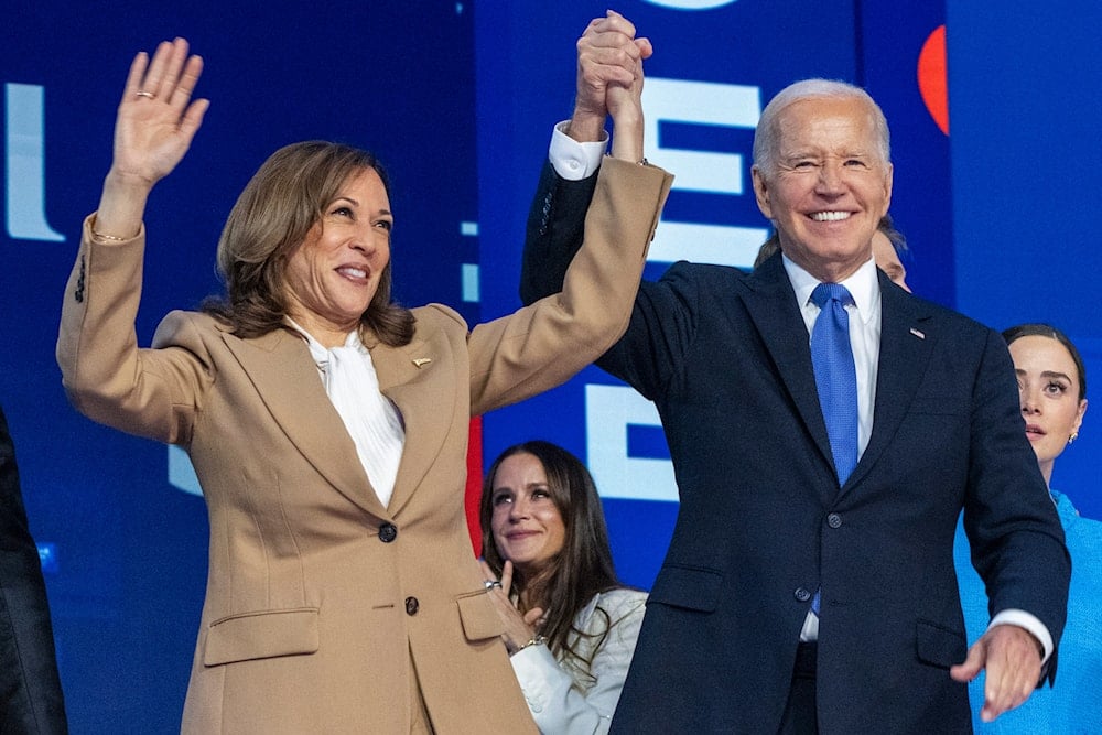 Democratic presidential nominee Vice President Kamala Harris, left, clasps her hand in the air with President Joe Biden at the Democratic National Convention, Aug. 19, 2024, in Chicago. (AP)