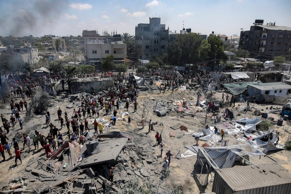 Palestinains inspect the damage at a site hit by an Israeli bombardment on Khan Younis, southern Gaza Strip, July 13,2024. (AP)