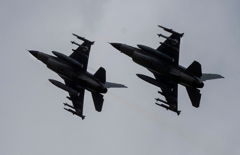 The Ukrainian Air Force's F-16 fighter jets fly in an undisclosed location in Ukraine, Sunday, Aug. 4, 2024. (AP)