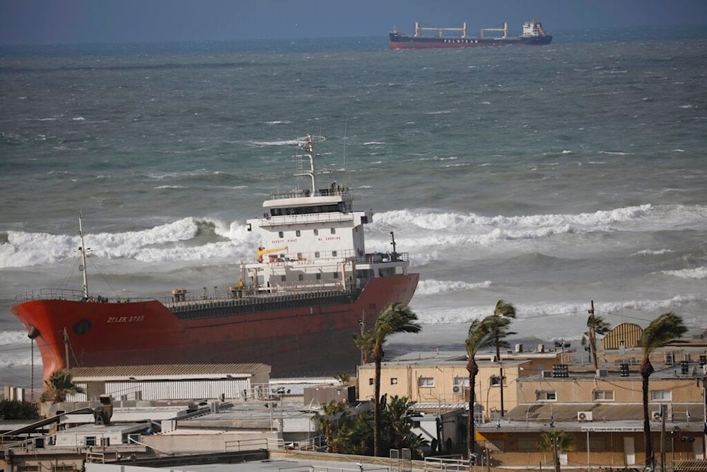 The Zelek Star cargo ship carrying cement is stranded in the Mediterranean sea beach in the occupied port of Ashdod, Friday, Dec. 27, 2019 (AP)