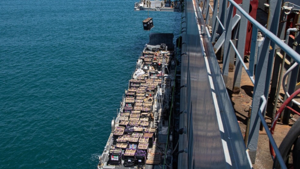 A picture released by CENTCOM shows aid being lifted onto a barge at the Israeli port of 