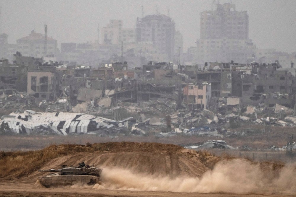 Israeli soldiers move on the top of a tank near the Gaza border on April 25, 2024. (AP)