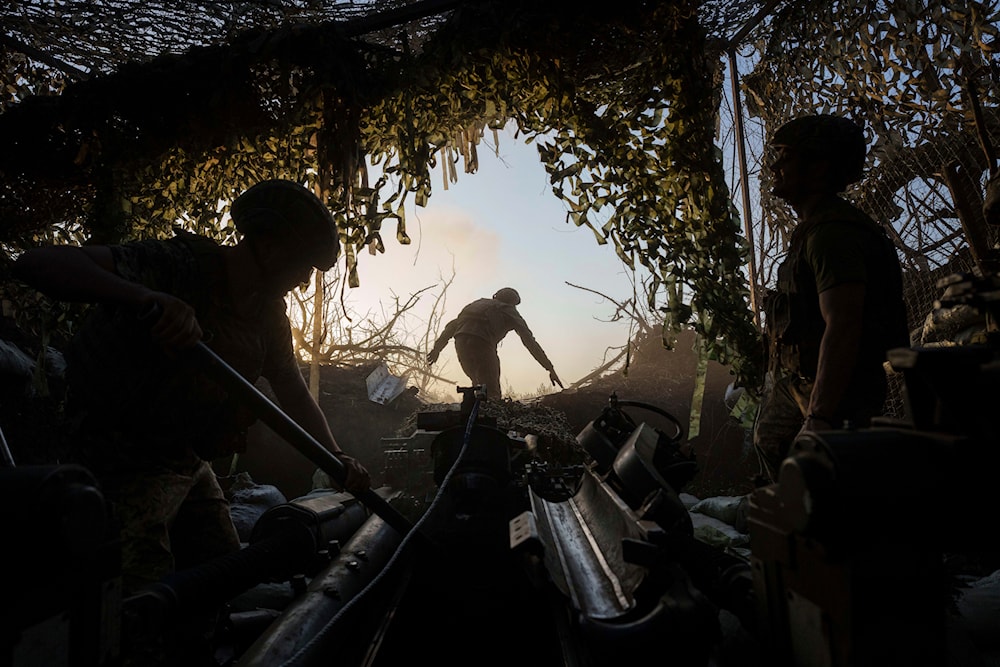 Ukrainian servicemen prepare a M777 howitzer to fire towards Russian positions at the frontline in Donetsk region, Ukraine, Wednesday, August 21, 2024. (AP)