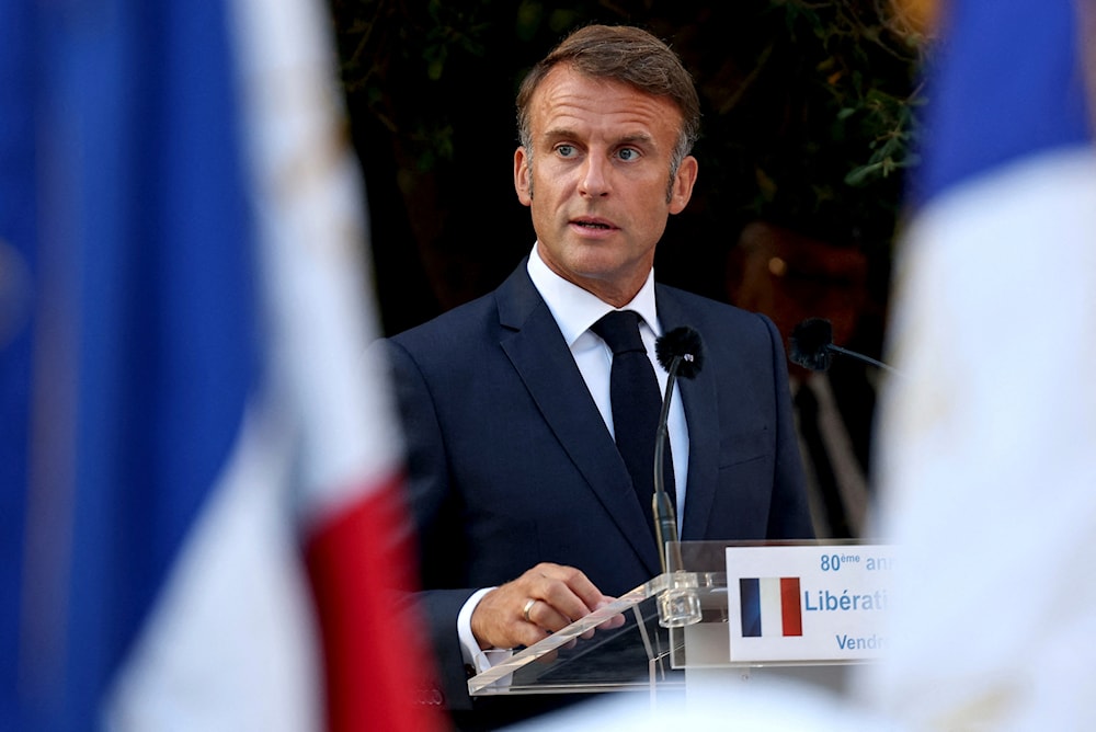 French President Emmanuel Macron speaks during a ceremony in Bormes-les-Mimosas, south-eastern France, Saturday, Aug. 17, 2024 (Poo/AP)