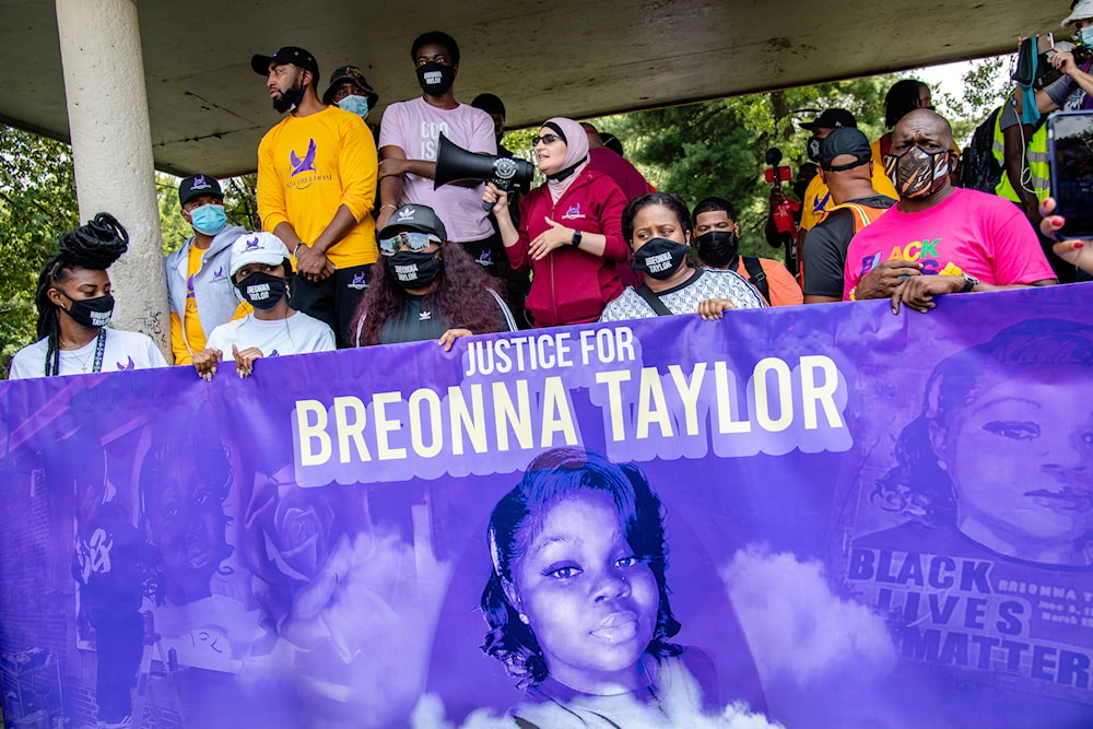 Linda Sarsour, center, speaks during the Good Trouble Tuesday march for Breonna Taylor on August 25, 2020, in Louisville, Ky. (AP)