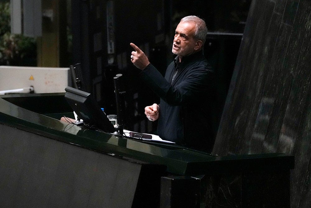 Iranian President Masoud Pezeshkian speaks during the debate on his proposed ministers in an open session of parliament, in Tehran, Iran, Wednesday, Aug. 21, 2024. (AP)