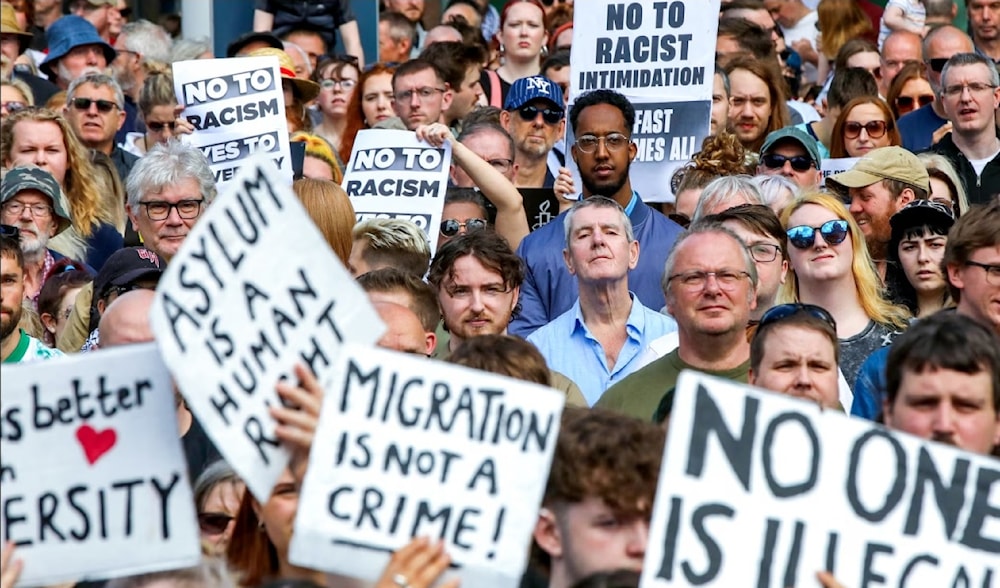 Thousands of people gathered at an anti-racism rally in Belfast earlier this month in response to the far-right riots, on August 10, 2024. (AFP)