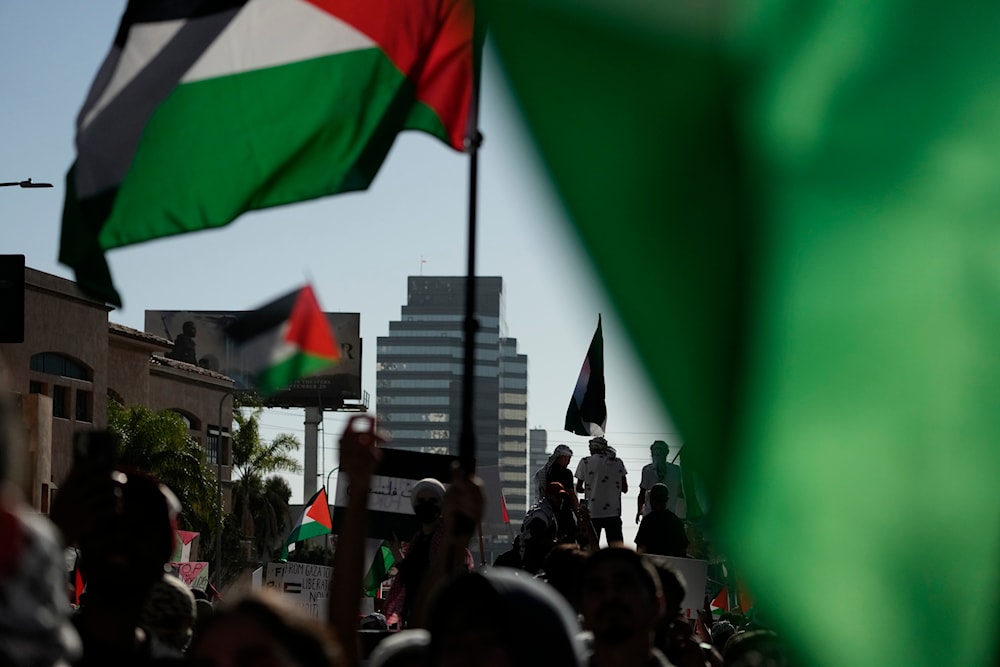 Demonstrators march during a pro-Palestinian protest in L.A on October 14, 2023. (AP)