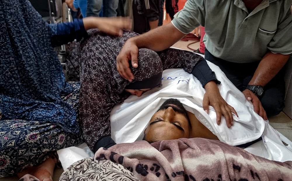 Palestinians mourn a relative killed in the Israeli bombardment of the Gaza Strip, at a hospital in Khan Younis, Saturday, Aug. 24, 2024. (AP)