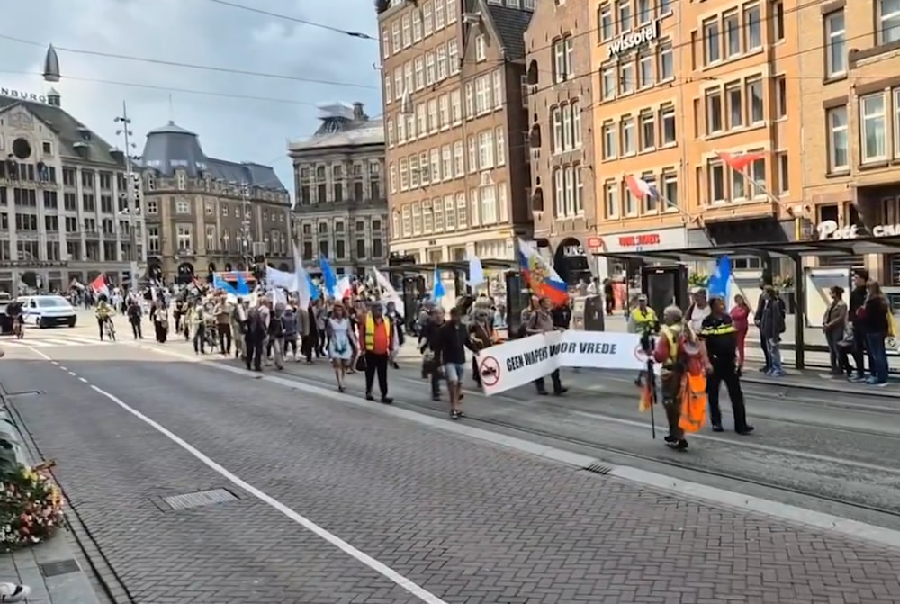 Demonstrators march in the streets of Amsterdam to protest armament to Ukraine, Amsterdam, The Netherlands, August 25, 2024. (@ivan_8848)