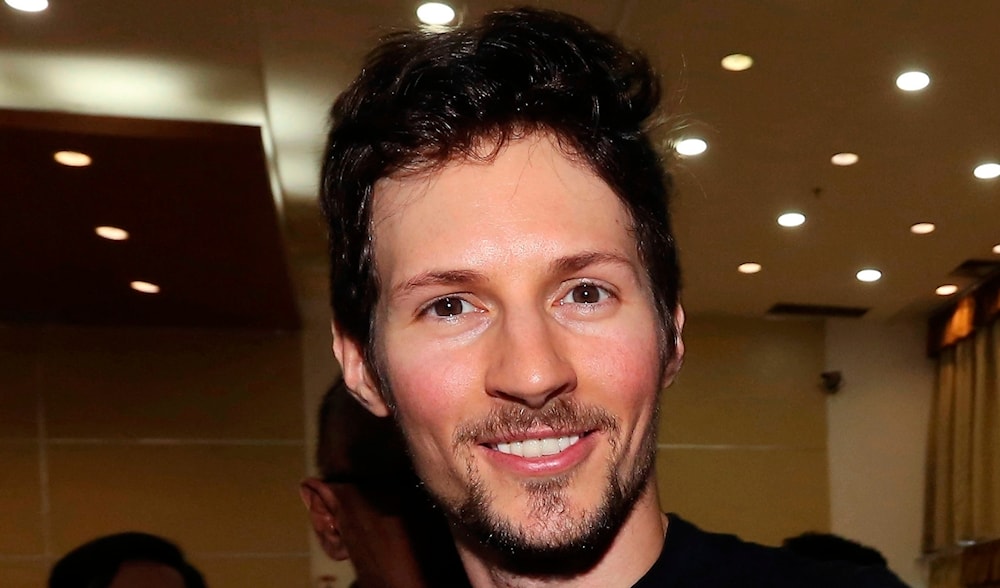 In this Aug. 1, 2017 file photo, Telegram co-founder Pavel Durov, center, smiles following his meeting with Indonesian Communication and Information Minister Rudiantara in Jakarta, Indonesia. (AP)