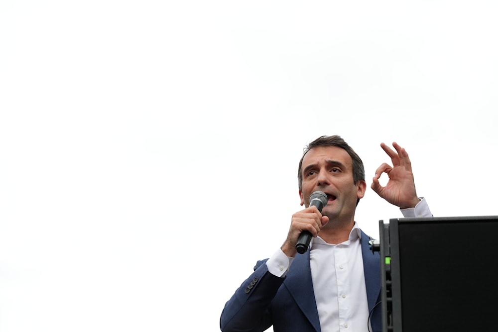 Far-right politician Florian Philippot adresses the crowd during a rally against the health pass, Saturday, Aug. 21, 2021 in Paris. (AP)