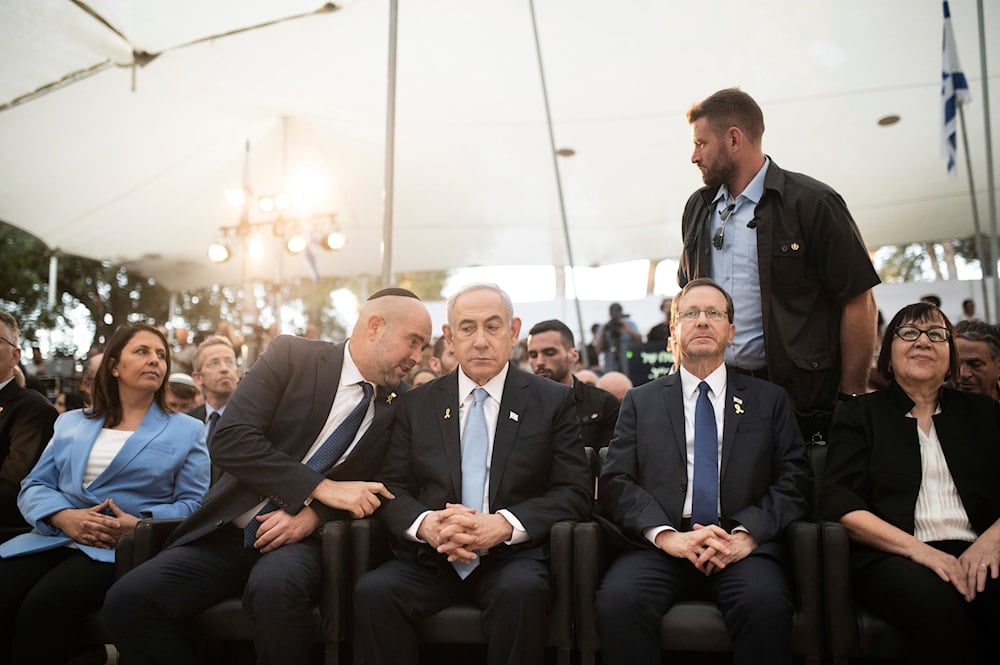 Israeli Prime Minister Benjamin Netanyahu, center, speaks with Knesset Speaker Amir Ohana, left, joined by President Isaac Herzog, center right, in occupied al-Quds, occupied Palestine, August 4, 2024 (AP)