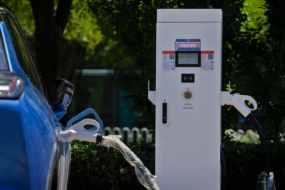 A Chinese electric vehicle charges at an electric vehicle charging station in Beijing, Monday, June 24, 2024. (AP)