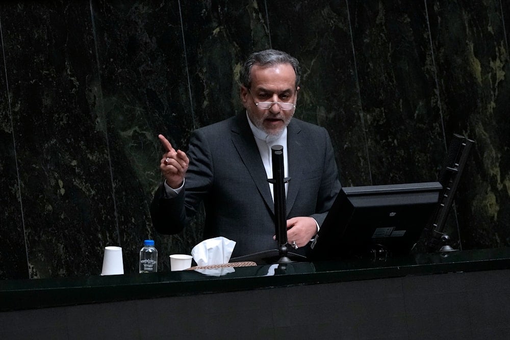 Foreign Minister Abbas Araghchi speaks in an open session of parliament during the second day of debate on the 19 proposed ministers by Iranian President Masoud Pezeshkian in Tehran, Iran, Aug. 18, 2024 (AP)