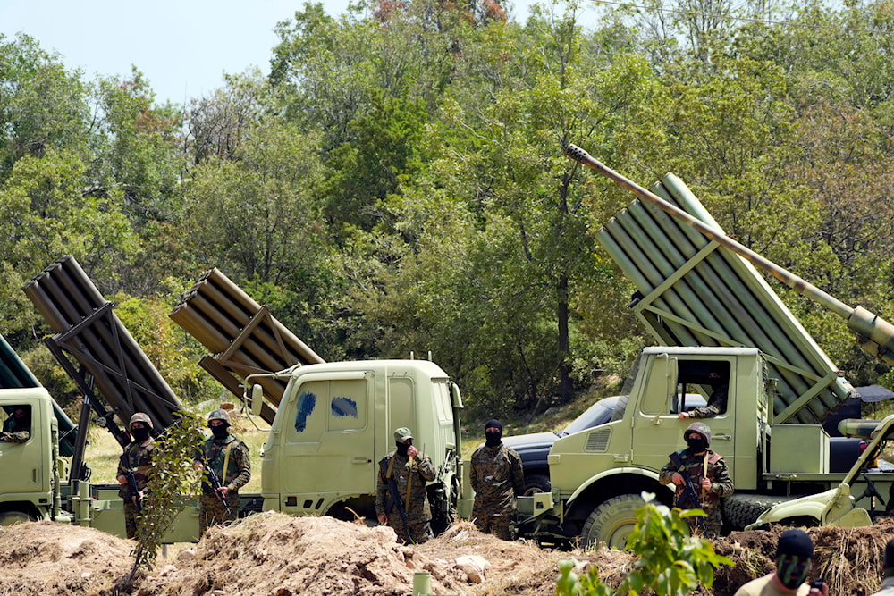 Hezbollah fighters stand next to multiple rocket launchers during a training exercise in southern Lebanon, Sunday, May 21, 2023. (AP)