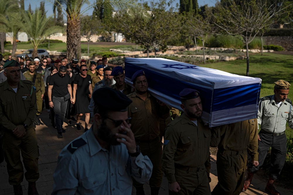 Israeli occupation soldiers carry the coffin of an Israeli occupation soldier killed in the Gaza Strip during his funeral in Tel Aviv, 'Israel', Thursday, July 25, 2024. (AP)