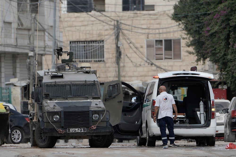 The Israeli occupation forces invading Jenin forcefully search a PRC ambulance during the wide-scale aggression against the West Bank, Palestine, Aug. 28, 2024. (AP)