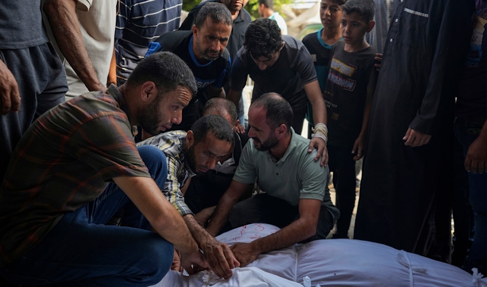 Palestinians mourn relatives killed in the Israeli bombardment of the Gaza Strip, at a hospital in Deir al-Balah, Palestine, Aug. 27, 2024. (AP)