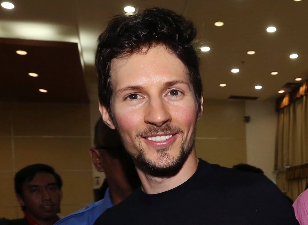  Telegram co-founder Pavel Durov, center, smiles following his meeting with Indonesian Communication and Information Minister Rudiantara in Jakarta, Indonesia on August 1, 2017. (AP)