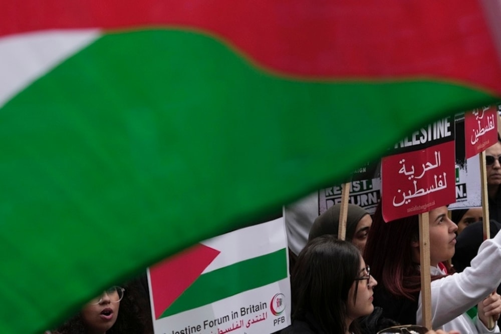 Students march during a pro-Palestinian demonstration in London, Saturday Oct 14,2023. (AP)