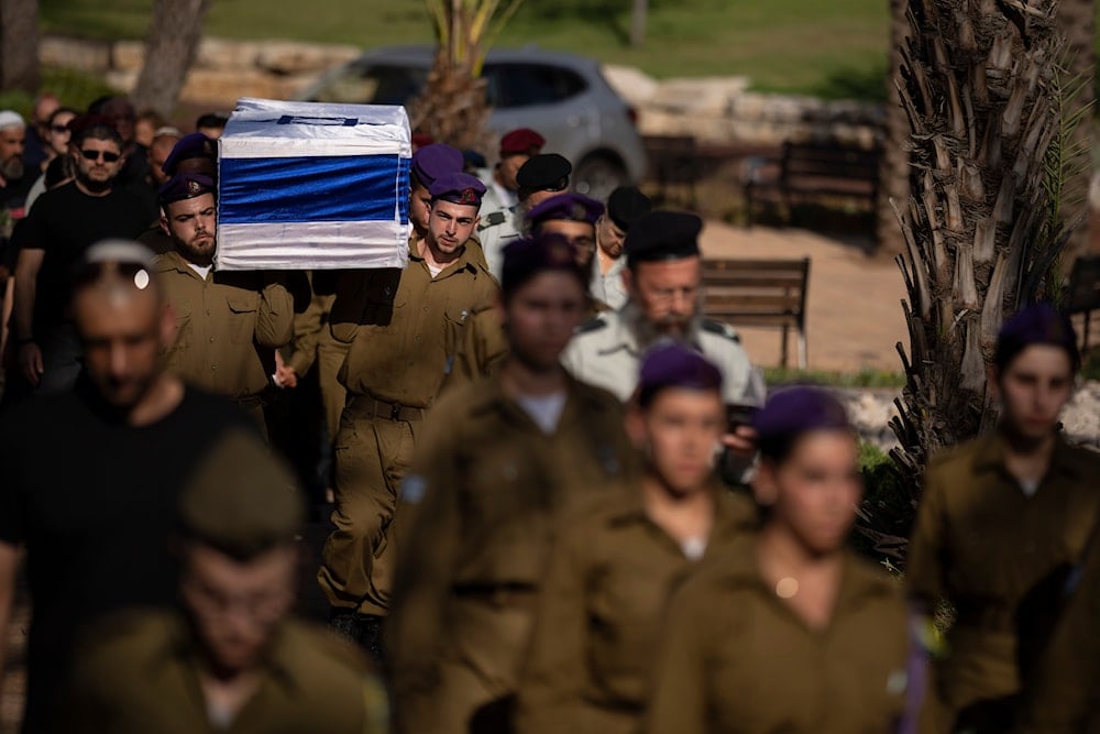 Israeli soldiers carry the flag-draped coffin of an IOF sergeant during his funeral at the Kiryat Shaul cemetery, in Tel Aviv, occupied Palestine, Thursday, July 25, 2024 (AP)