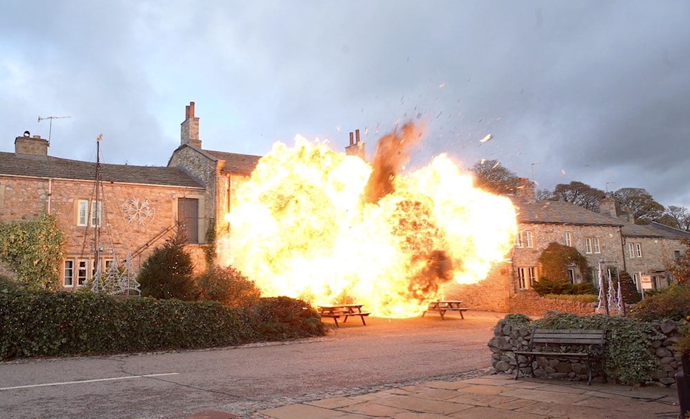 A photo of the Sunderland police station set on fire (X/@damekatydenise_)