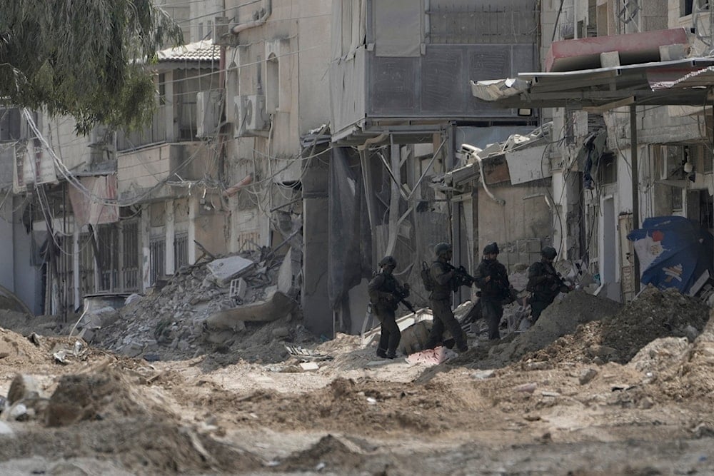 Israeli occupation soldiers patrol a street during the invasion of the West Bank refugee camp of Nur Shams, Tulkarm, Thursday, Aug. 29, 2024. (AP)