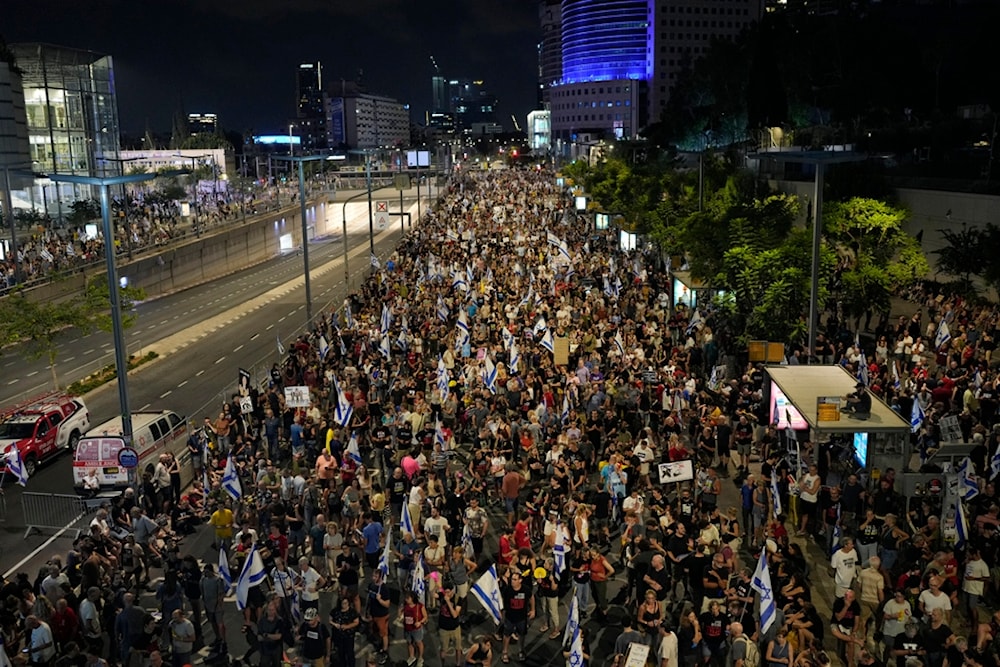 Settlers protest against Israeli Prime Minister Benjamin Netanyahu's government and call for the release of captives held in the Gaza Strip in Yaffa, occupied Palestine, Saturday, August 31, 2024 (AP)