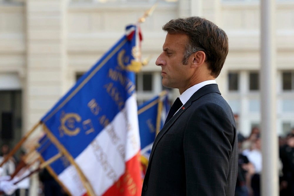 French President Emmanuel Macron attends a ceremony to mark the 80th anniversary of the police Prefecture liberation in Paris, Monday Aug. 12, 2024. (Alain Jocard, Pool via AP)